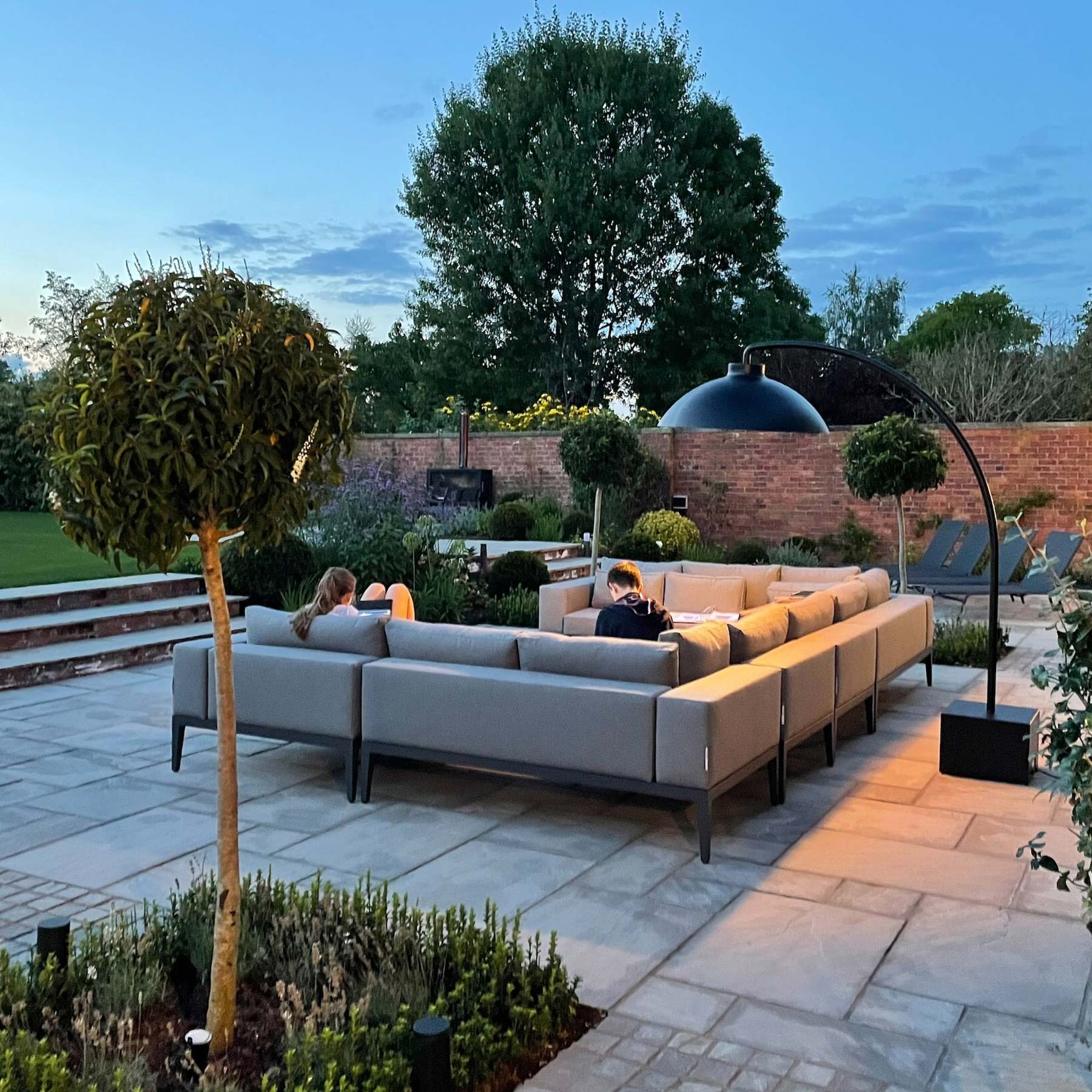 Modern Fabric Patio Sofa Set At Dusk | Alexander Francis